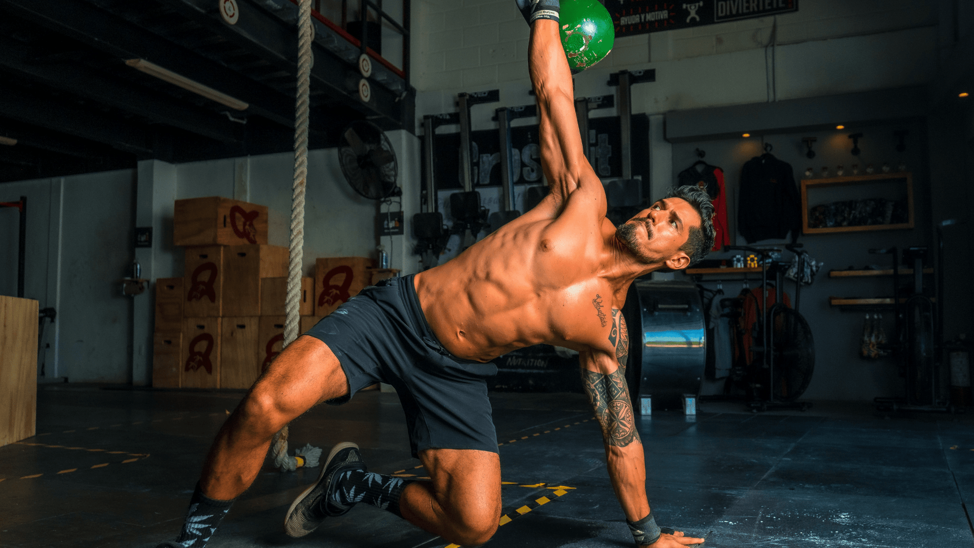 Man with kettle Bell - Hydrate to Dominate: Tips for Preventing Dehydration and Muscle Cramps During Training